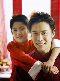 Boy with father during festival