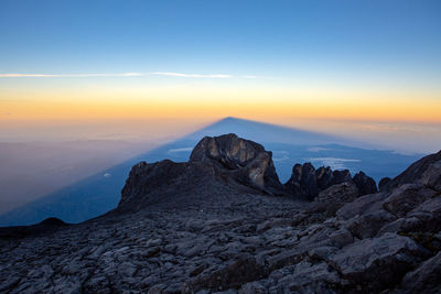 Scenic view of mountain against sky during sunset