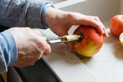 Midsection of man preparing food