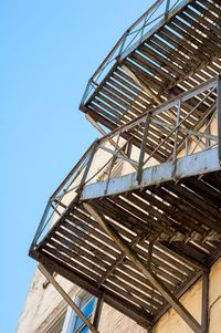 Low angle view of building against clear blue sky