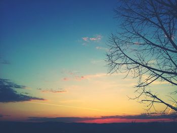 Silhouette of tree against sky at sunset