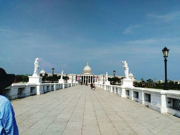 Statue of building against cloudy sky