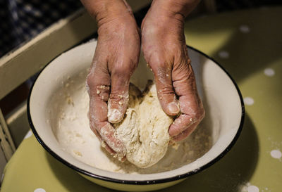 High angle view of person preparing food in cooking pan