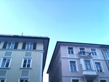 Low angle view of building against clear blue sky