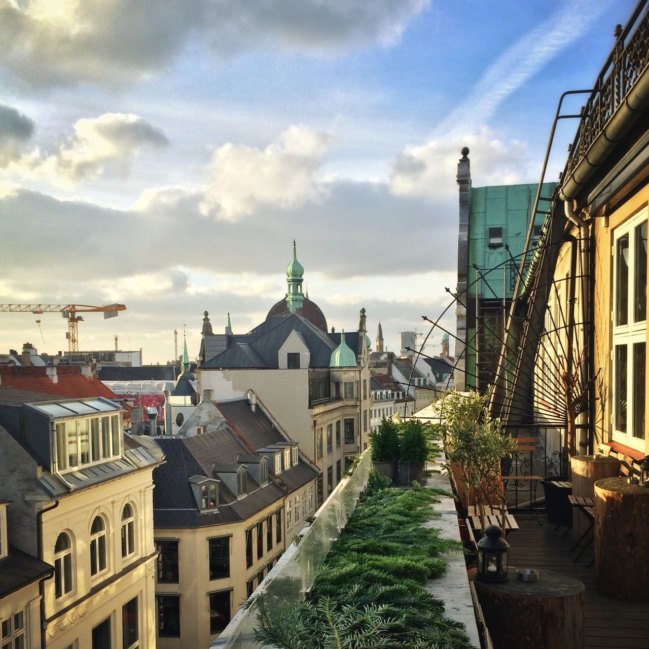 architecture, building exterior, built structure, sky, house, residential structure, residential building, cloud - sky, cloud, tree, roof, town, day, residential district, outdoors, building, city, railing, cloudy, no people