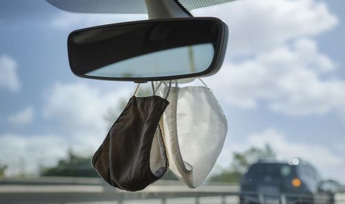 Close-up of sunglasses against sky