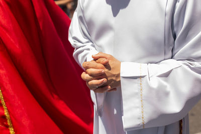 Catholic priests are seen participating in the procession in honor of santa luzia