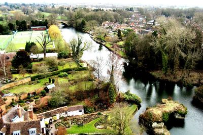 High angle view of river amidst trees against sky
