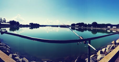 Scenic view of lake against blue sky