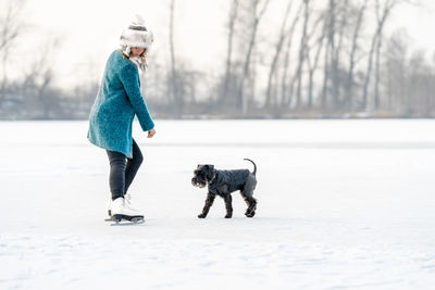 Full length of dog on snow