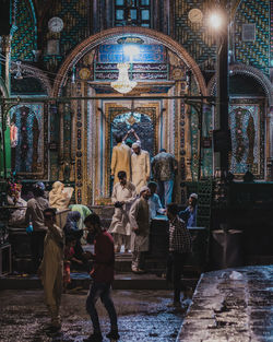 Group of people in illuminated building