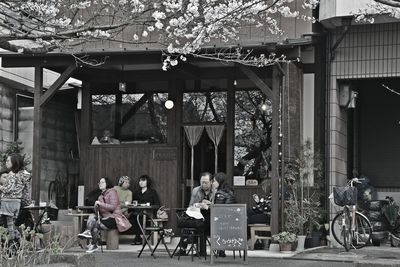 People on sidewalk against buildings