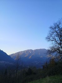 Scenic view of mountains against clear blue sky