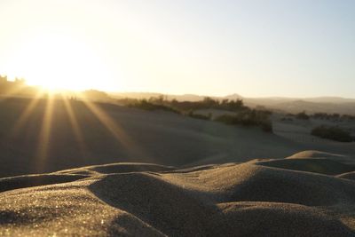 Scenic view of landscape against sky during sunset