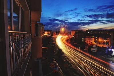 Light trails on road in city at night