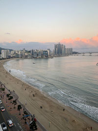 Scenic view of beach against sky during sunset