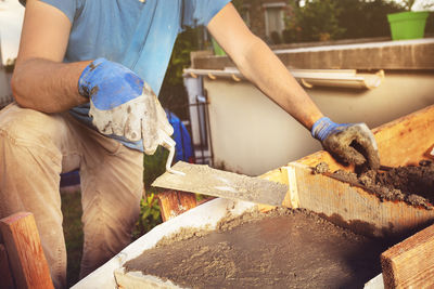 Midsection of man working at construction site