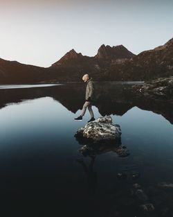 Side view of a man at calm lake