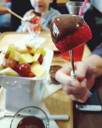 Close-up of hand holding ice cream