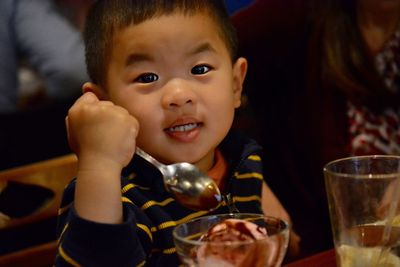 Portrait of cute boy eating