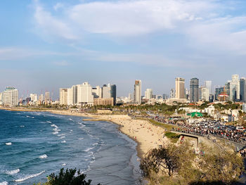 Buildings by sea against sky in tel aviv 