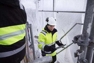 Engineer walking at building site