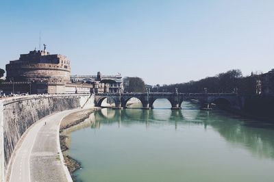 Bridge over river against clear sky