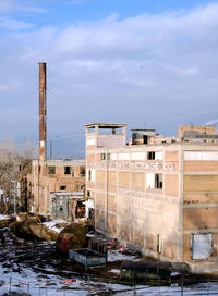 Buildings in city against sky