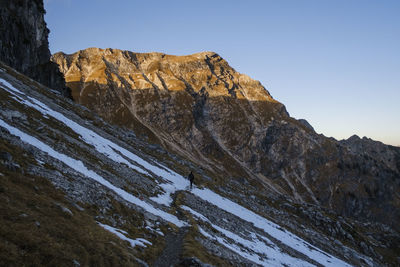 Low angle view of snowcapped mountain against sky