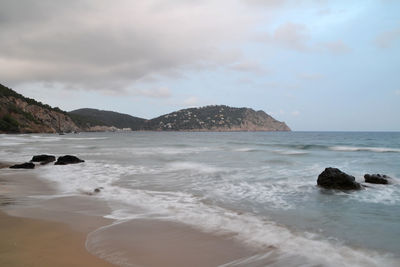 Scenic view of sea against cloudy sky at balearic islands