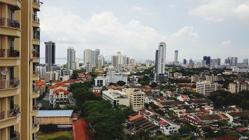 High angle view of buildings in city against sky