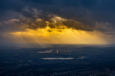 Aerial view of cityscape against sky during sunset