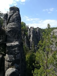 Low angle view of rocks against sky