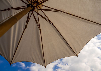 Low angle view of umbrella against sky