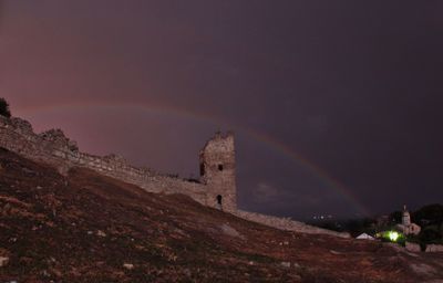 Scenic view of rainbow against sky at night