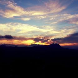 Scenic view of mountains at sunset