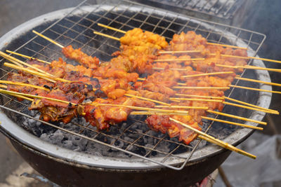 Close-up of meat on barbecue grill