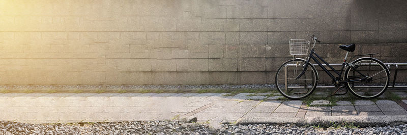 Bicycle leaning on wall