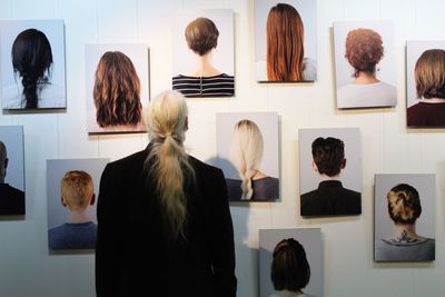 Rear view of man standing in barber shop