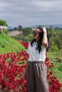 Young woman standing on field