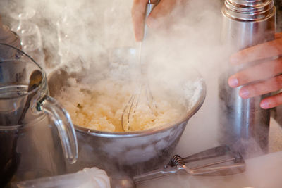 Midsection of man preparing food