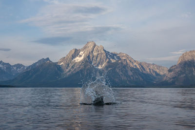 Scenic view of lake against mountain range