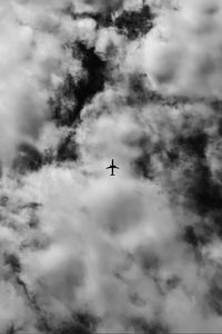 Low angle view of airplane flying in sky