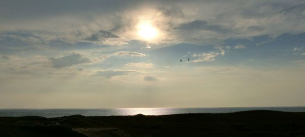 Scenic view of sea at sunset