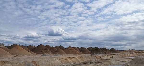 Rock formations in desert against sky