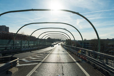 Bridge over road against sky