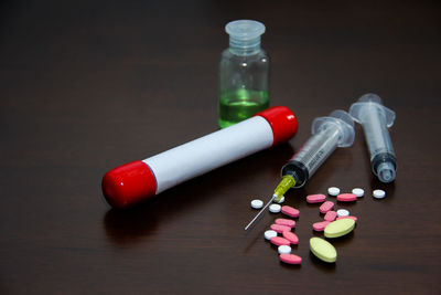 High angle view of multi colored bottles on table