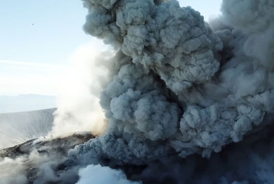 Smoke emitting from volcanic mountain