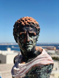 Close-up of statue against clear blue sky