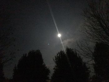 Low angle view of moon in sky at night